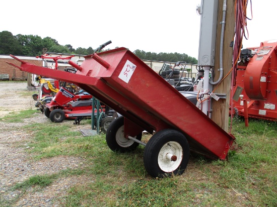 Red tilt-bed yard trailer