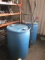 (2) Blue Barrels with barrel cart