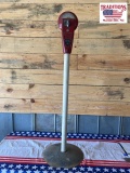 Vintage parking meter on a pole with base