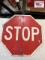 STOP sign with SLOW on reverse side