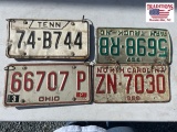 Six vintage vehicle tags