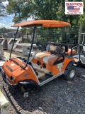 Orange Club Car Golf Car with Plum Quick Motor