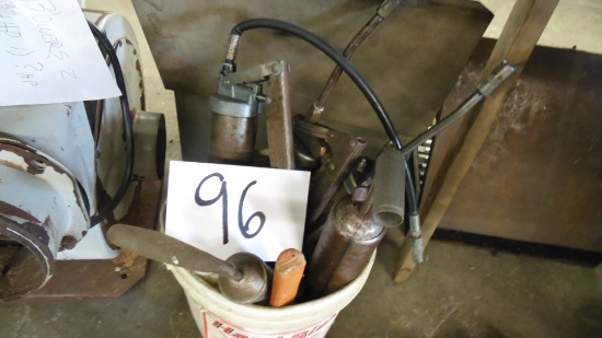 Bucket of grease guns