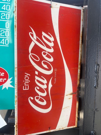 Coca-Cola sign approximately 1 ft x 2 ft