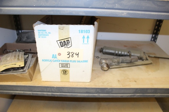Contents of shelf Grease gun calk gun