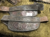 TWO CARVED LEATHER SADDLE PARTS