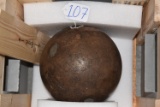 Large caliber solid shot, most likely from naval or coastal artillery