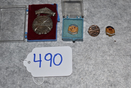 Grouping of Winchester Pins & Badge – 1st is Junior Rifle Corps Marksman Badge – 2nd is 10 Year Serv