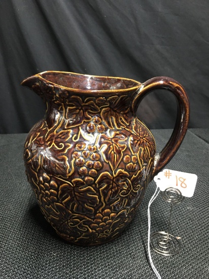 BROWN STONEWARE PITCHER WITH LEAVES AND GRAPES
