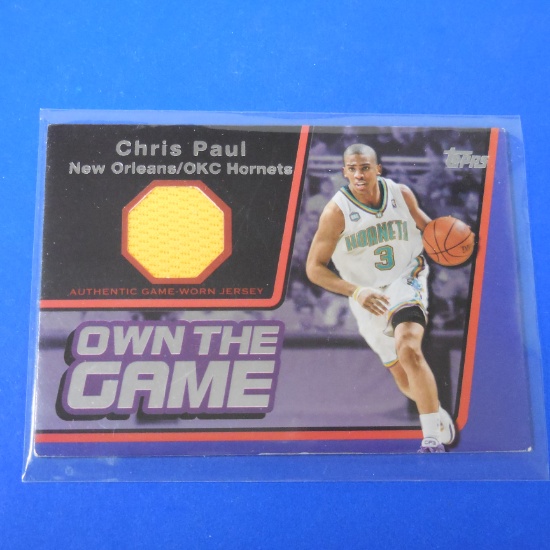 2006-07 TOPPS CHRIS PAUL OWN THE GAME GAME USED JERSEY CARD #D 90/99 HORNETS