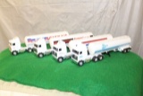 (4) 1/64 MACK CABOVER TRUCKS WITH  PLASTIC TANKERS