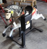 Coin operated carousel horse on stand
