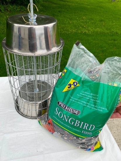 (1) homemade bird feeder and seed