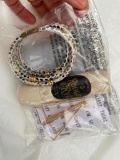 Snake skin bracelet, Rough Rye perfume oil and triangular earrings