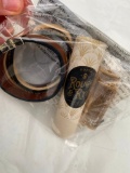 brown leathers bracelet, perfume oil, rectangular earrings