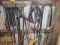 Contents of West Wall, Pole Saw, Bungees, Jumper Cables, Grease Guns, Wire