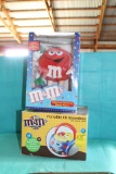M & M Portable boom box and animated Christmas figurine in boxes, boxes hav