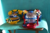M & M telephone, candy dish, candy dispenser and M & Ms on theater seat