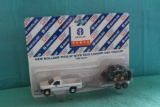 (2) 1/64 New Holland pickup with tractor and trailer and pickup with skid l