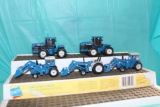 (5) 1/64 (2) New Holland 4wd, (3) Ford tractors with loaders, no bubbles
