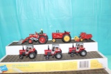 (4) 1/64 MF, (1) Massey Harris tractors and Massey Harris Combine, no bubbl