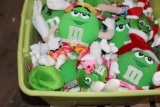 (2) Plastic totes of green stuffed M & M characters and plastic M & M chara