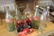 (6) Glass Coca Cola bottles in cardboard holder some unopened, (6) Glass so