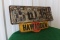 Hawarden Corner Hardware metal sign under license plate, 15.5