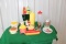 Various toy food pieces, shakers, condiment squirt bottles