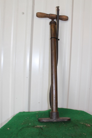 Vintage air pump, hose is slightly frayed by base