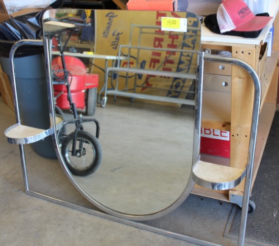Mirror on metal bracket with shelves