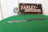 Harley-Davidson license plate cover, Whitaker Buick logo, Ford Lincoln Merc