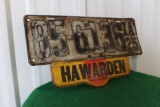 Hawarden Corner Hardware metal sign under license plate, 15.5