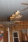 Lumber, shed steel, garage door opener hanging from ceiling