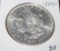 1885 O MORGAN SILVER DOLLAR, BRILLIANT UNCIRCULATED