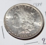 1884 MORGAN SILVER DOLLAR, BRILLIANT UNCIRCULATED