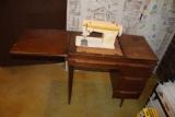 SINGER SEWING MACHINE IN CABINET, IRONING BOARD