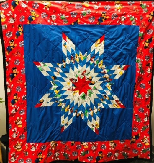 PAW PATROL STAR PATTERN BABY QUILT, DONATED BY LAVERNE GOODTHUNDER