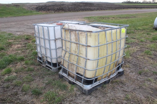 (2) 250 GALLON POLY TOTES IN STEEL CAGES, HOLES IN TOTES