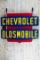 Large Chevrolet Oldsmobile Shield Shaped Metal Dealership Reproduction Sign