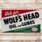 Fantastic 1964 Ask for Wolf's Head Oil and Lubes Emb. Single Sided Tin Logo Sign