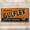 Your Car Needs Gulflex Registered Lubrication Emb. Single Sided Tin Sign w/ Logo