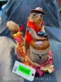 Moon shinning Fox Squirrel, with Old McCormick Whiskey jug, on cedar base 12 inches tall X 17 inches