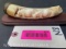 Hippo tusk/ivory,-carving of two Hippo?s on a wood display, tusk is 6 3/4 inches long on a 8 inch wo