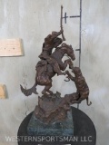 C.M. Russell A Bronze Sculpture of a Western Mountain Man on Horseback Being Attacked by Cougar