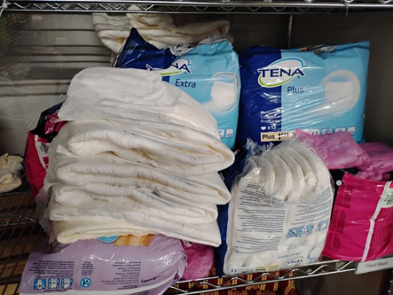 LOT OF ADULT DIAPERS AND PADS - SIZE XL/2X