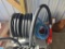 Diesel pump with hose reel and meter