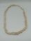 2 Strands of Vintage Puka Shell Necklaces