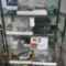 Rack w/Contents:  Key Pad, Dead Bolt, Turn Buckles, Motorola Mdl. GR1225, P