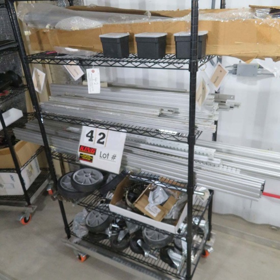 Rack w/Contents:  Castor Wheels, Roller Chain, Axle Stops, Aluminum Mountin